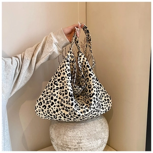Close-up of leopard print fabric texture on a large capacity minimalist tote bag