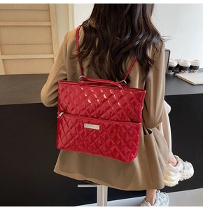 Close-up of a vibrant red quilted PU leather backpack worn by a model in a trendy setting