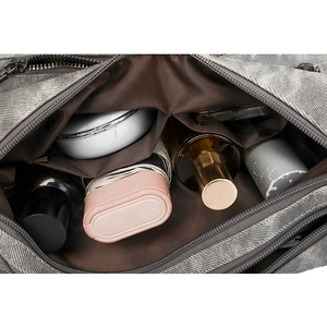 Detailed interior of the grey PU crossbody bag showing spacious compartments with lining