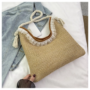 Fashionable woven straw shoulder bag with white lace trim and cotton rope handles
