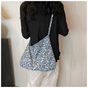 Floral print hobo bag with blue flower patterns shown from a rear view perspective