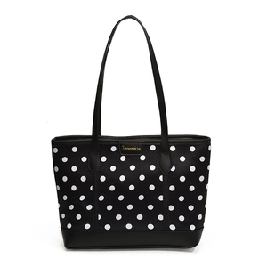 Classic black and white polka dot tote bag with premium black leather handles and base