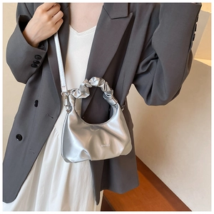 Silver PU leather shoulder bag featuring a unique gathered handle and cloud shape