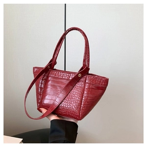 Chic burgundy faux leather handbag with crocodile pattern and golden hardware detailing