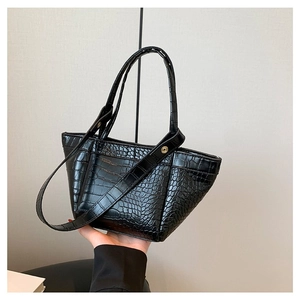 Minimalist black faux crocodile pattern tote bag with top handles and adjustable strap