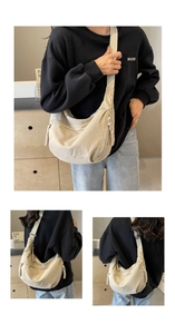 Detail of adjustable strap and woven rope zipper on beige crescent canvas bag