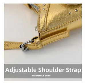 Detailed close-up of the adjustable strap buckle and rivet on a gold leather handbag