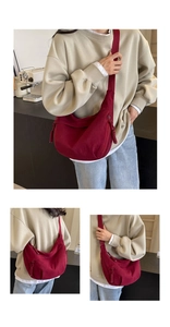 Detailed close-up of burgundy canvas crossbody bag featuring a unique braided zipper puller