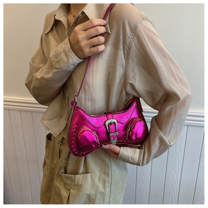 Detail of fuchsia metallic PU leather shoulder bag featuring silver rivets and retro buckle