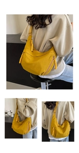 Macro view of bright yellow half-moon nylon crossbody bag with chunky braided zipper detail