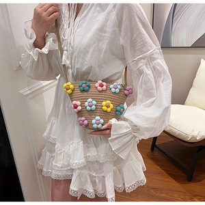 Summer woven cotton linen crossbody bag with colorful plush flower decorations for women