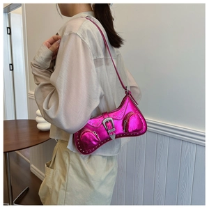 Detail of rose red metallic PU shoulder bag with silver rivets and Y2K biker style design