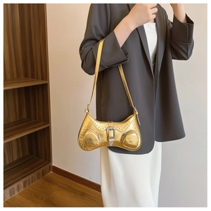 Detailed view of the gold PU shoulder bag with metallic rivets and decorative buckle