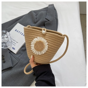 Straw woven bucket crossbody bag with white daisy flower and pearl buckle closure