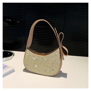 Sac croissant en paille avec broderie florale et grand nœud sur la poignée