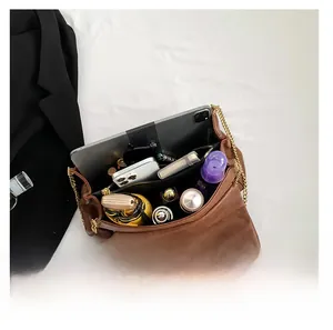 Detail view of the brown PU leather handbag interior showcasing its large storage capacity