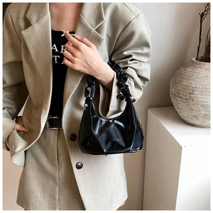 Minimalist black glossy PU leather hobo bag with a pleated handle and MUDUO logo