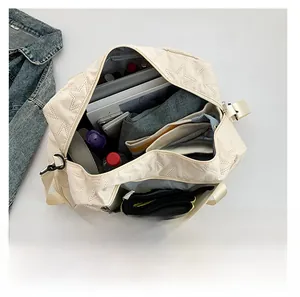 Spacious interior of star-quilted canvas crossbody bag showing large storage capacity