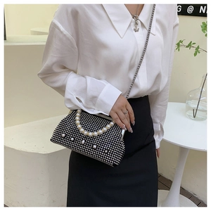 Elegant black evening clutch with silver rhinestones and pearl handle detail