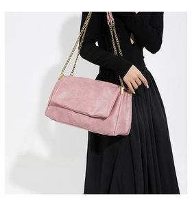 Chic pink PU leather flap bag with square stitching detail and gold chain strap