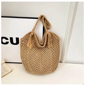 Minimalist beige woven crochet tote bag with matching tassel and handmade texture