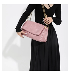 Pink PU leather shoulder bag with bold gold chain strap and fine stitching detail