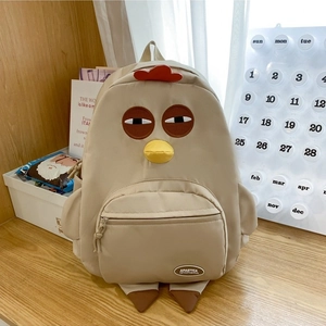 Minimalist beige nylon backpack with cute cartoon chick design and large front pocket