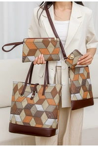 Detail view of four-piece handbag set featuring 3D geometric patchwork and crocodile texture