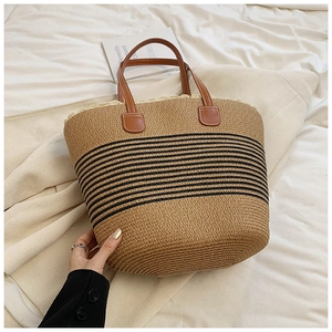 Minimalist straw woven tote bag with black stripes and brown leather handles for women