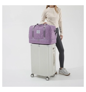 Purple nylon travel bag with star-quilted design and convenient trolley sleeve detail
