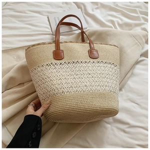 Summer woven straw tote bag with brown leather handles and three-tier textured design