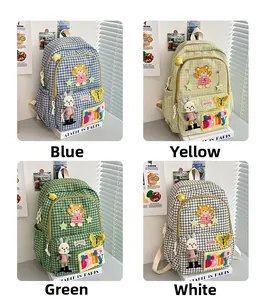 Grid display of checkered backpacks in blue, yellow, and green with cute cartoon patches