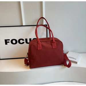 Minimalist dark red canvas tote bag with adjustable shoulder strap for women