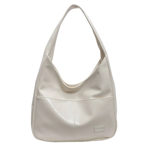 Minimalist cream white PU leather tote bag with wide shoulder strap and fashion label