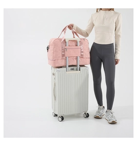Pink quilted star fabric travel bag with luggage trolley sleeve for easy commuting