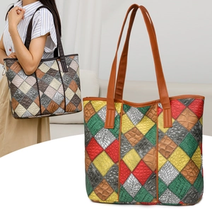 Detail view of large PU leather tote bag with colorful animal embossed pattern
