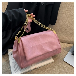 Minimalist pink PU leather shoulder bag with quilted texture and gold chain strap
