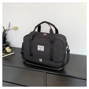 Versatile black travel tote bag with star quilting and separate shoe compartment