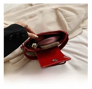 Detail view of the spacious inner compartment of the red PU leather crossbody square bag