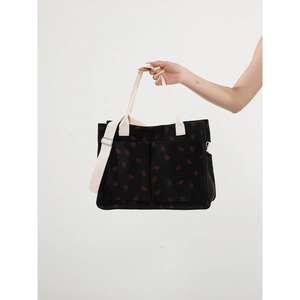 Black corduroy strawberry print tote bag with multiple pockets and adjustable strap