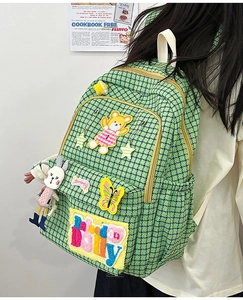 Green houndstooth nylon backpack with cute embroidery patches and rabbit plush toy