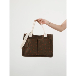 Brown corduroy strawberry print tote bag with double front pockets and adjustable strap