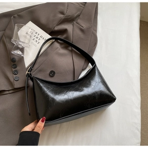 Chic black PU leather shoulder bag with vintage wax texture and adjustable strap
