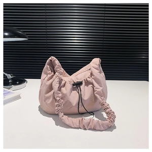 Pink fabric shoulder bag with scrunchie strap and drawstring closure for women