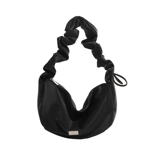 Chic black PU leather shoulder bag with ruched handle and silver logo detail
