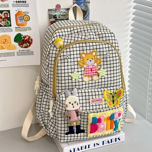 Chic black and white houndstooth nylon backpack with cute bear and rabbit charms