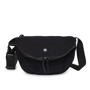 Minimalist black crescent crossbody bag in washed canvas with adjustable strap and zip