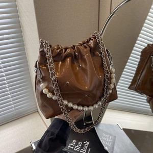 Quilted caramel PU leather bucket bag with pearl handle and silver chain strap