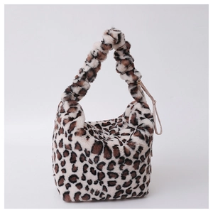 Detailed view of leopard print plush handbag with soft faux fur texture and drawstring