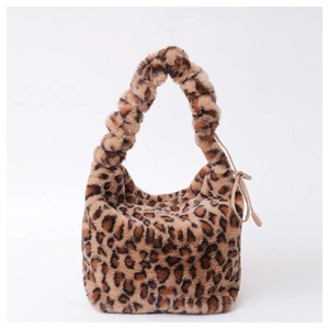 Detail showing plush leopard print faux fur texture and trendy ruched handle design